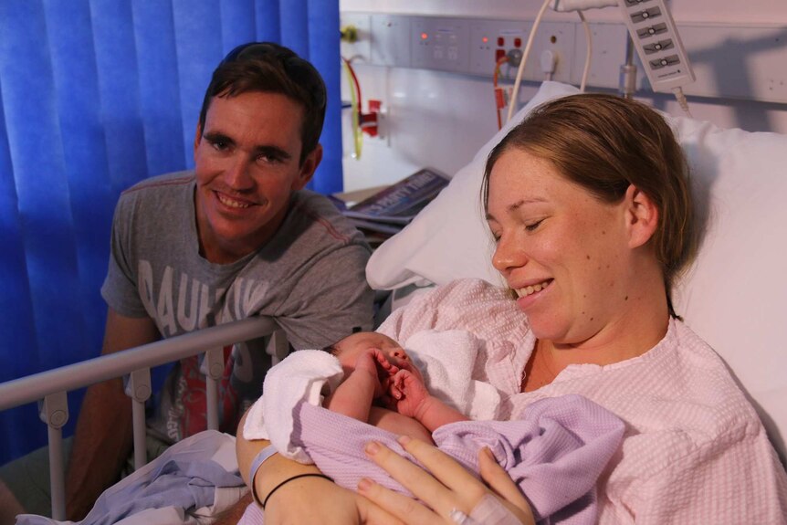 Darwin parents Joe and Jess D'Arcy with their newborn