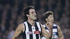Alan Didak celebrates one of his five goals against the Cats