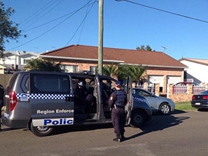 Police outside house after raid
