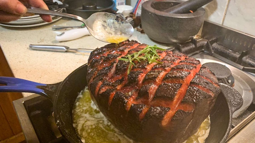 Watermelon smoked like ham in a pan.