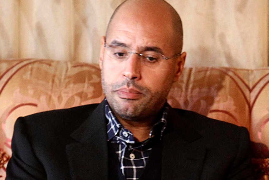 Seif al-Islam speaks during an interview