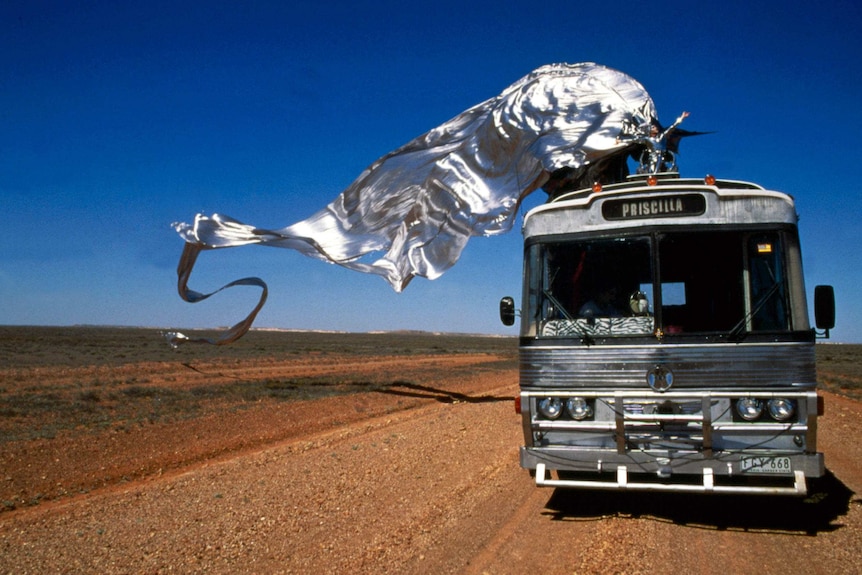 A still from The Adventures of Priscilla, Queen of the Desert, featuring the silver wings costume.