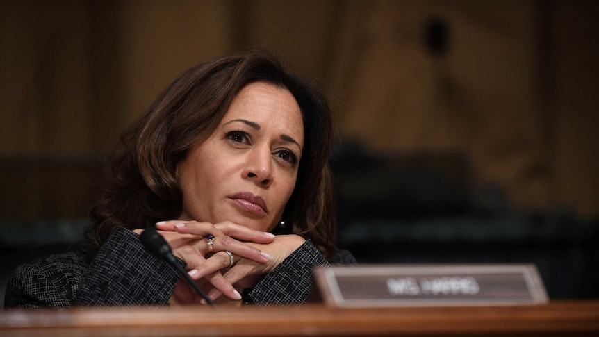 Sen. Kamala Harris listens with her head on her hands during a US Senate Judiciary Committee hearing