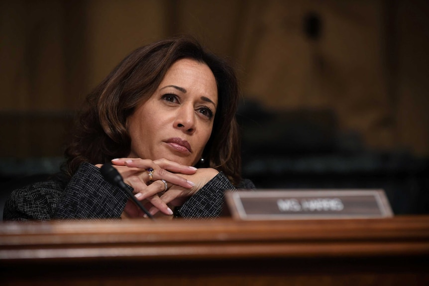 Sen. Kamala Harris listens with her head on her hands during a US Senate Judiciary Committee hearing