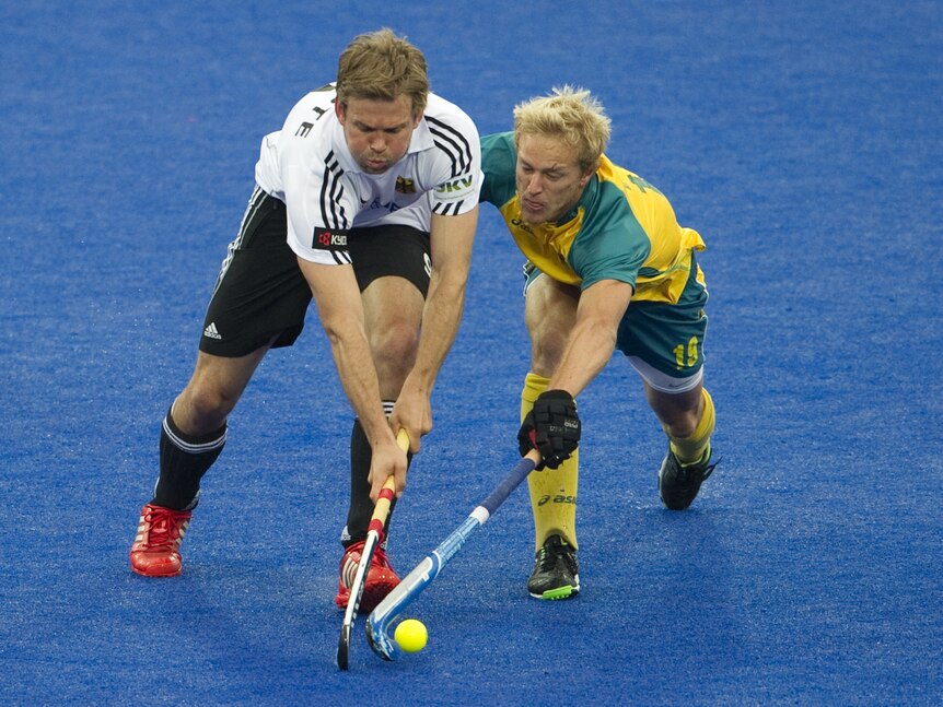 Moritz Fuerste (left) challenges Australia's Timothy Deavin