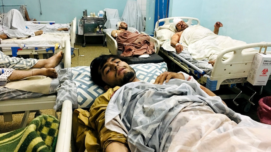 Victims lie wounded in a Kabul hospital after the attack