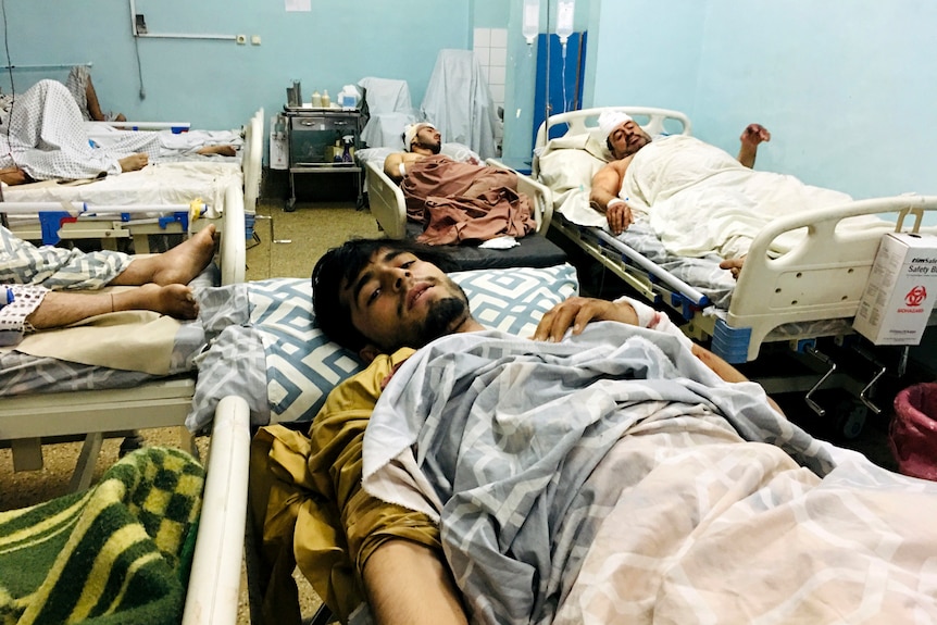 Victims lie wounded in a Kabul hospital after the attack