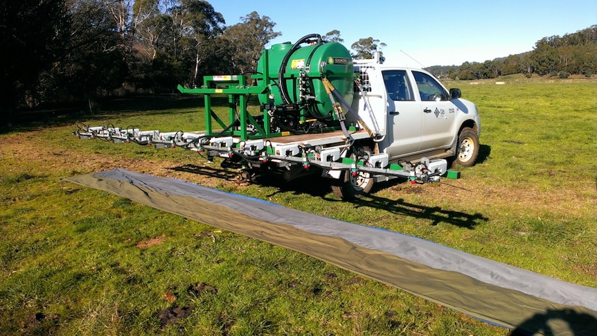 A boom sprayer fitted with optical sensors in a dairy pasture in Tasmania
