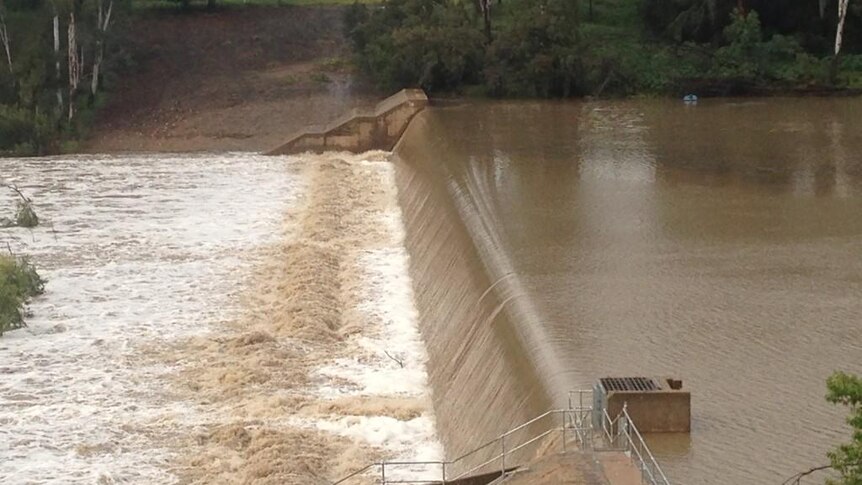 Burnett river flows over the weir at Mundubbera following Tropical Cyclone Marcia