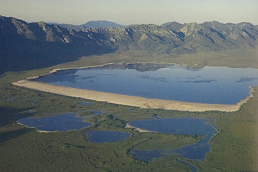 A lake nestled in a mountain range.
