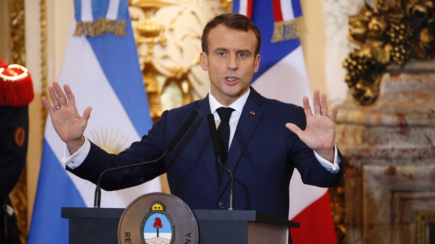 French president Emmanuel Macron speaks with his palms up ahead of G20 summit in Argentina