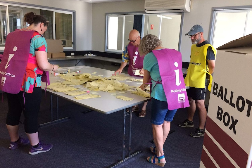 ECQ staff count postal votes in the Queensland election.