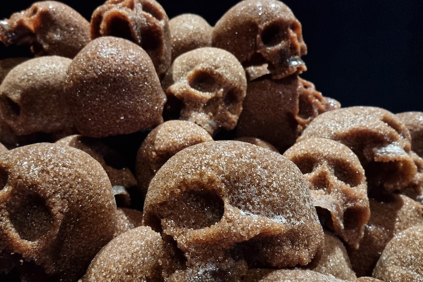 A close up of pile of skulls, made out of sugar.