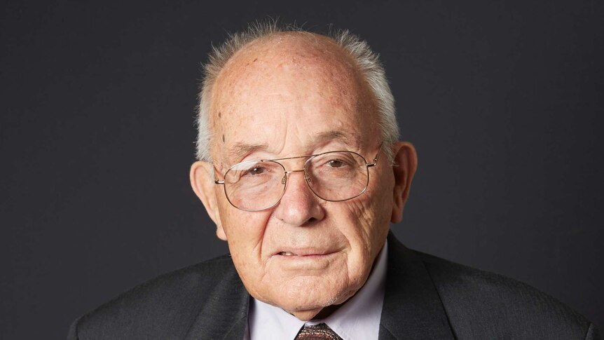 Portrait of an elderly man wearing war medals.