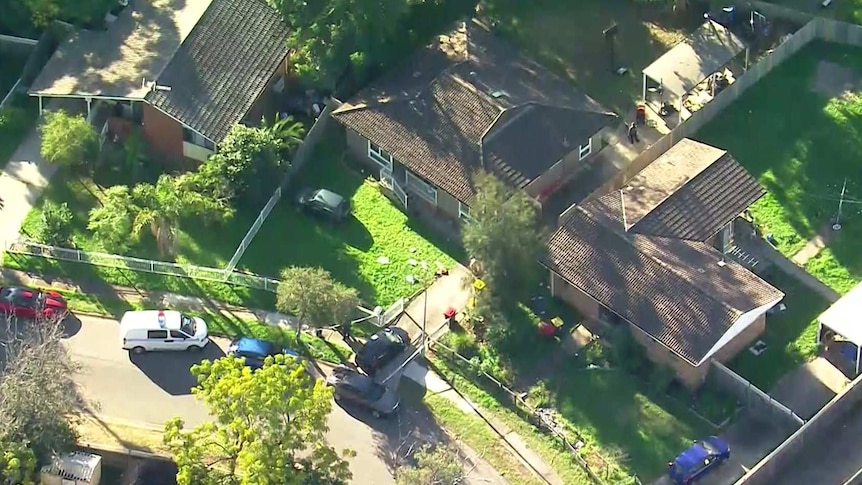 aerial vision of a house with a police van out front