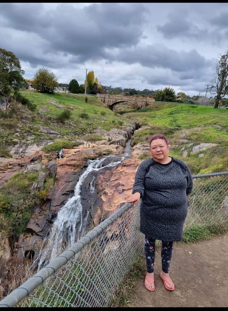Asian woman in tourist photo