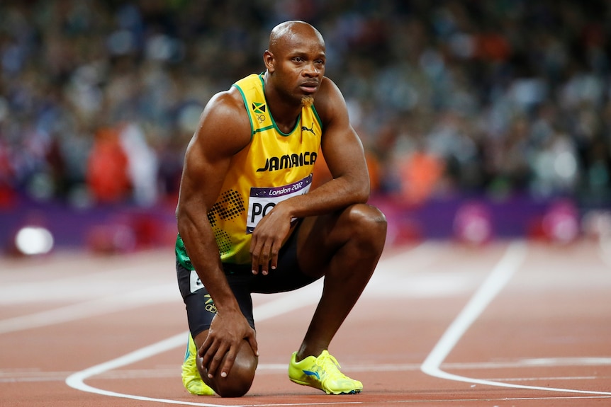 What might have been ... Asafa Powell looks on after finish last.
