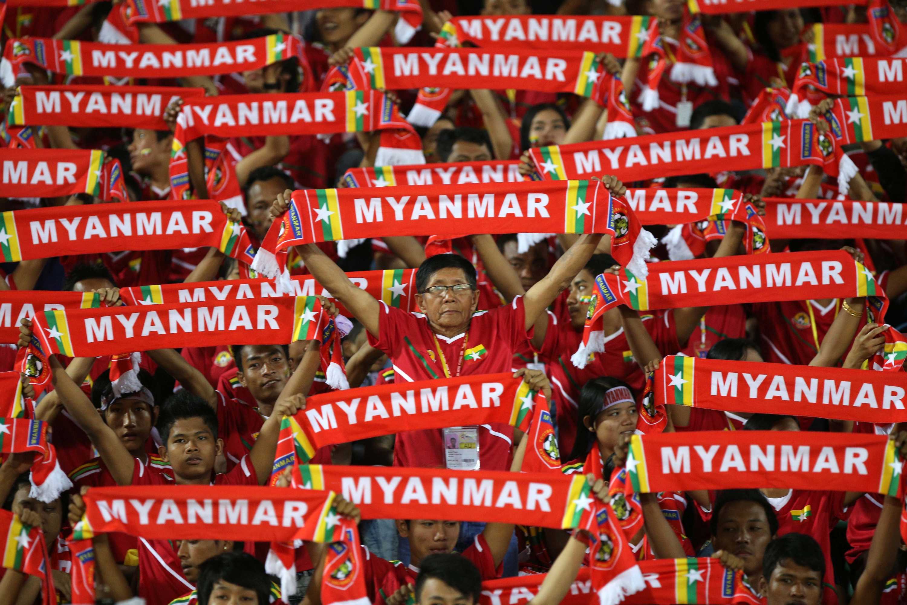 Myanmar fans watch their football team take on Cambodia in Yangon, December 7, 2013.