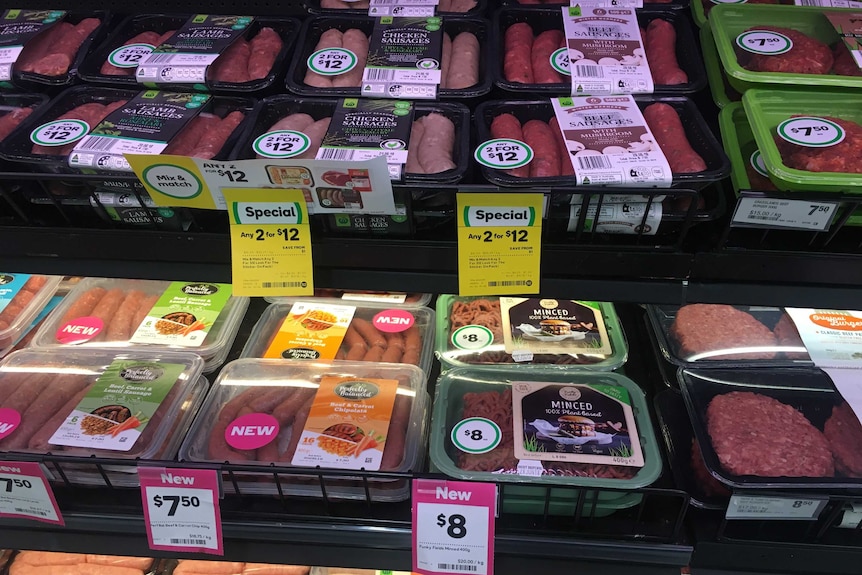 Plant-based product labelled as "mince" sits on the shelf of Dubbo Woolworths in between sausages and beef items.