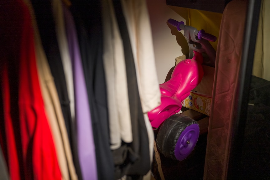 Darcey's pink trike in a cupboard at Peter Jackson's home.