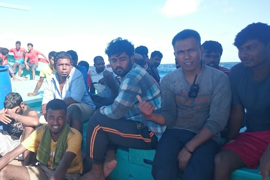 A group of males on board an Indonesian asylum seeker boat