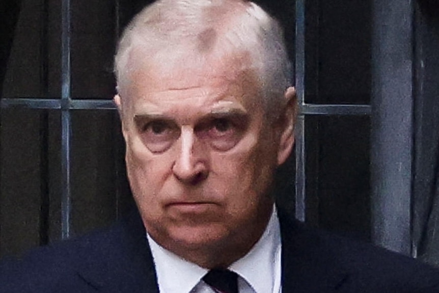 Prince Andrew stands outside Westminster Abbey at the thanksgiving service for Prince Philip.