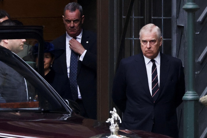 Prince Andrew stands outside Westminster Abbey at the thanksgiving service for Prince Philip.