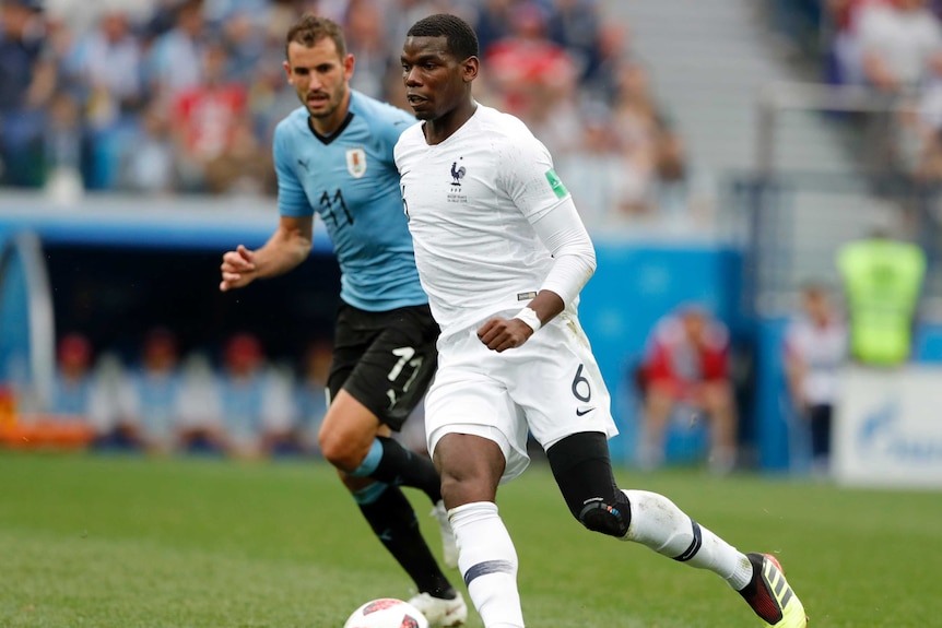 France's Paul Pogba plays the ball against Uruguay