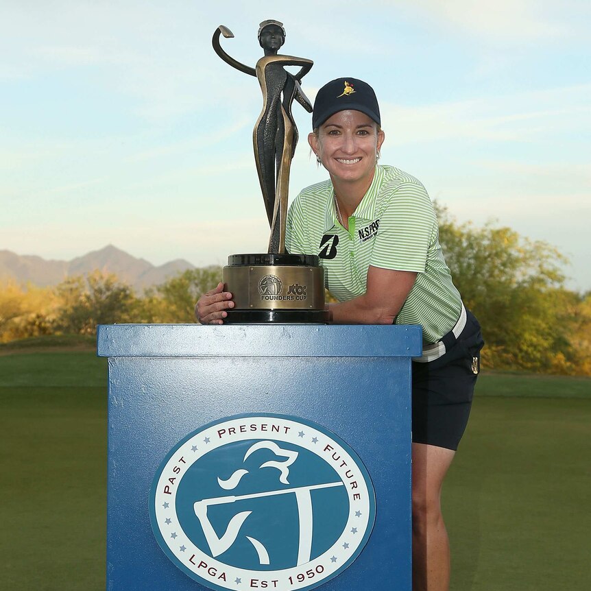Karrie Webb celebrates with Founders Cup trophy