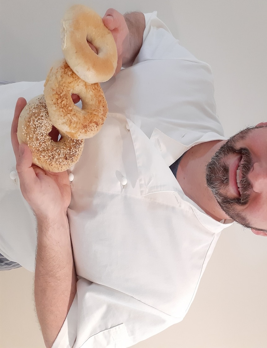Mark Walker, who has started a bagel business during COVID-19 lockdown, holding some bagels in Ballarat in 2020