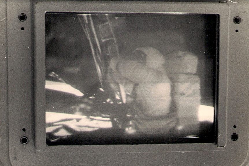 A 1960s screen at the Honeysuckle Creek Tracking Station shows footage of Neil Armstrong taking his first step onto the moon.