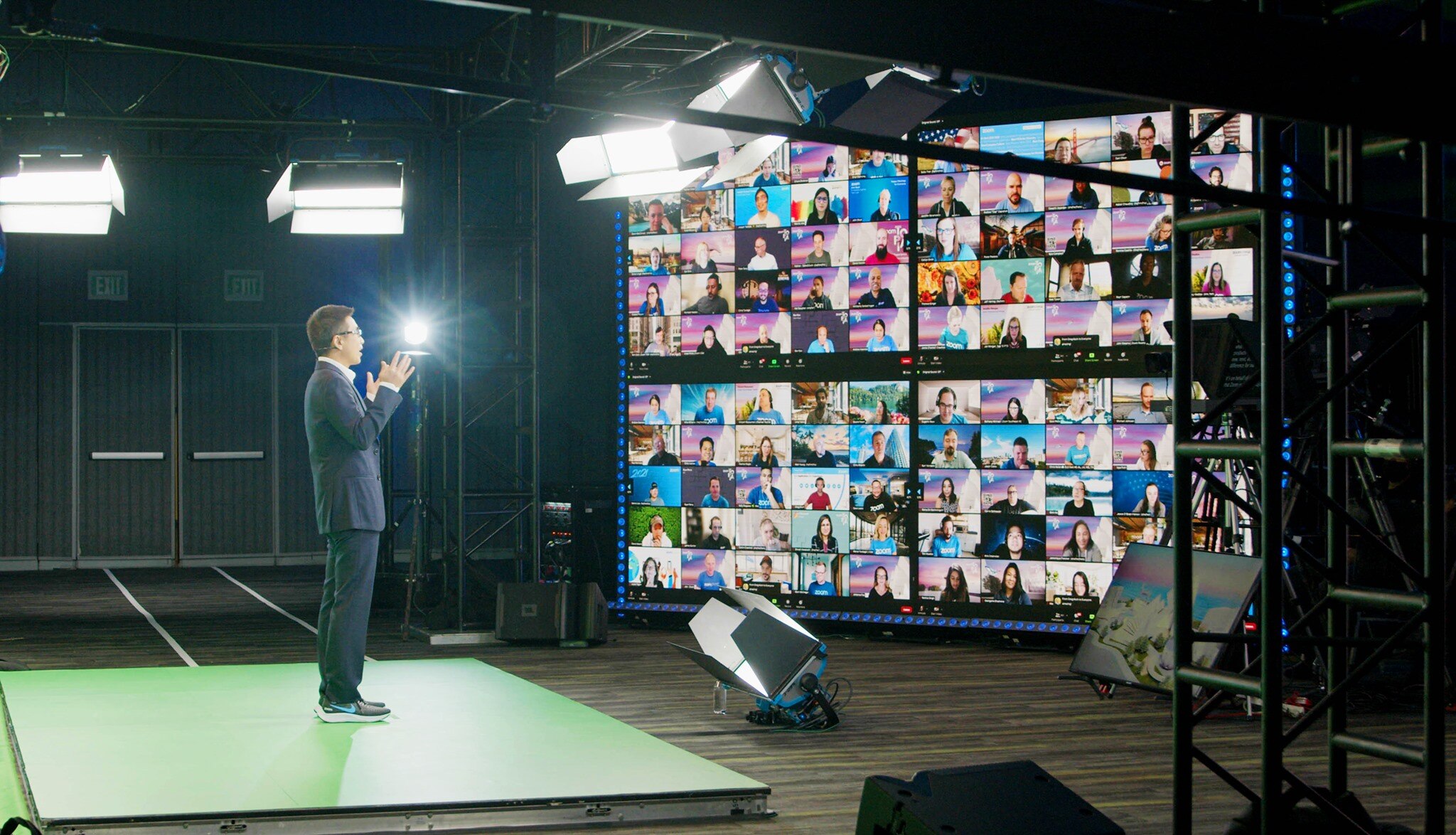 A man gives a speech to people tuning in on a Zoom meeting.