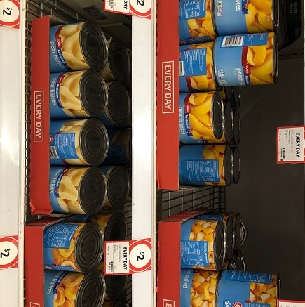Coles brand SPC canned fruit on supermarket shelves