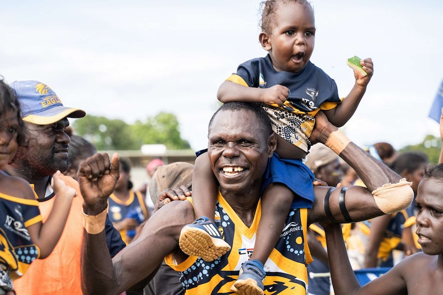 Ranku Eagles player Graham 'Aeroplane' Puruntatameri with his family.