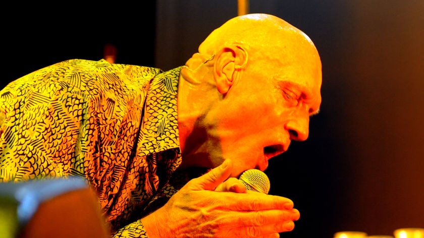 Midnight Oil lead singer and Environment Minister Peter Garrett performs in Canberra on March 12, 20
