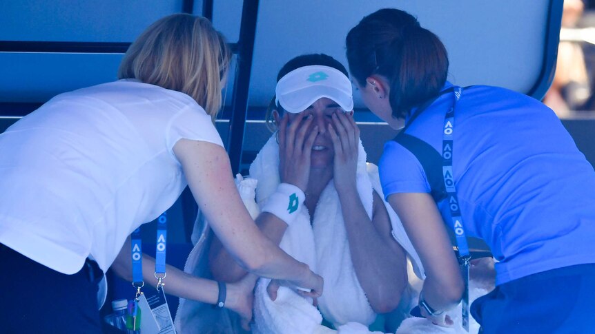 France's Alize Cornet struggles with the heat at the Australian Open.