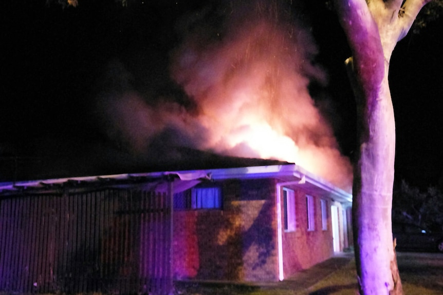 Duplex house on fire at night in Fisher Street at Bucasia in Mackay.