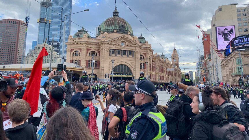 Extinction Rebellion protesters outside Flinders St station.