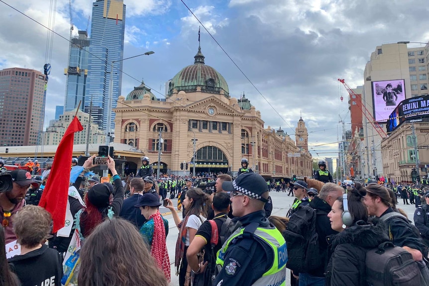 Extinction Rebellion protesters outside Flinders St station.