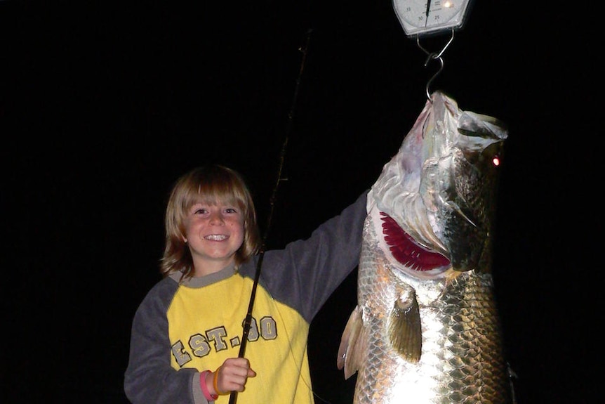 Nine-year-old Riley Vallance with his big barramundi catch.