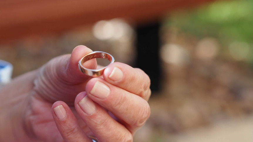 Pip Courtney holds her and John Bean's wedding ring.