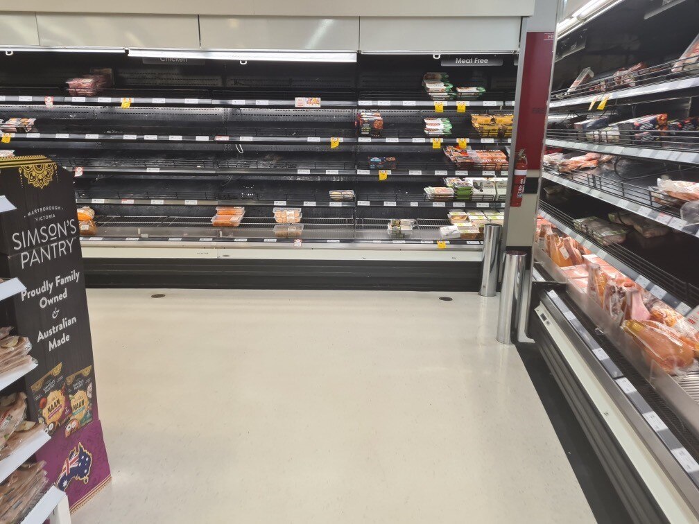 a meat shelf that's almost empty