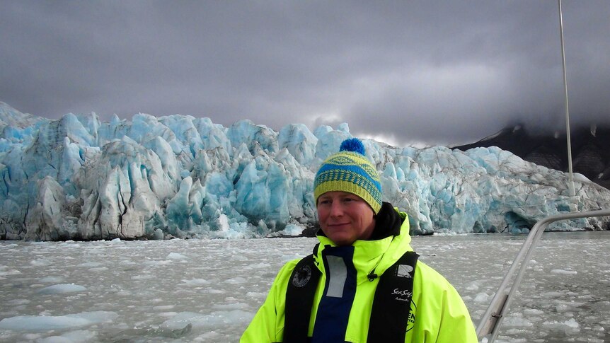 Tom Foreman stands in front of glacier