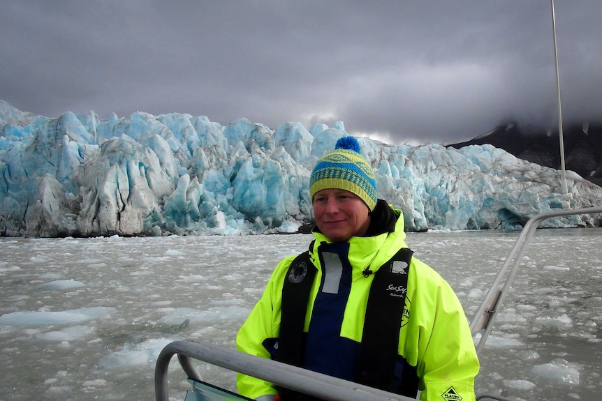 Tom Foreman stands in front of glacier