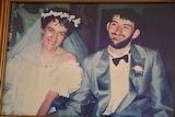 An old wedding photo shows a younger Jenni and David in their wheelchairs.