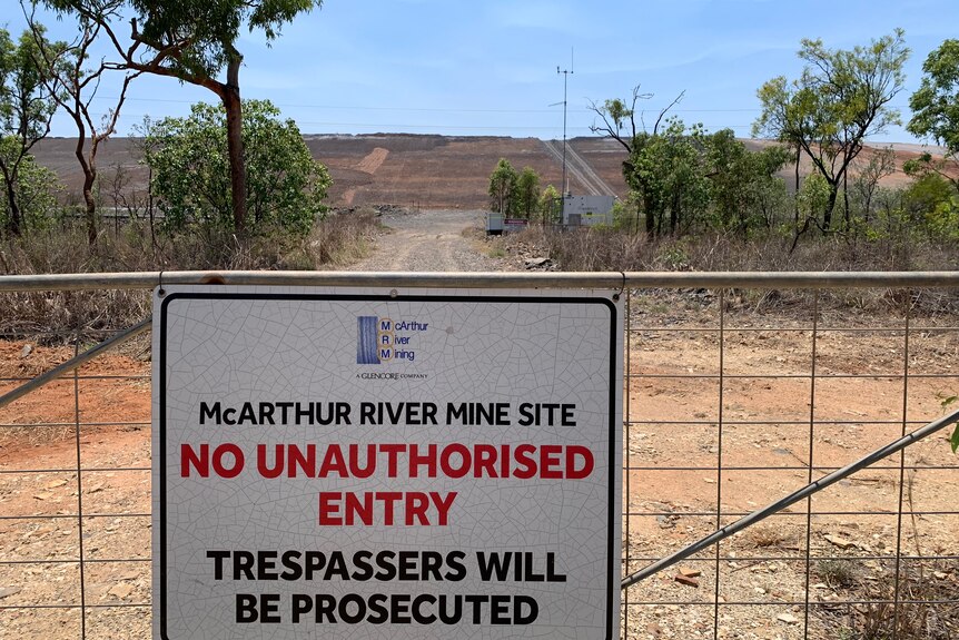 A sign on a gate at the entrance of the McArthur River Mine.