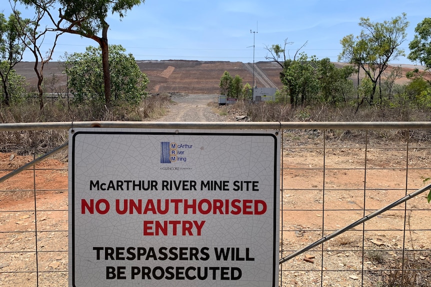 A sign on a gate at the entrance of the McArthur River Mine.
