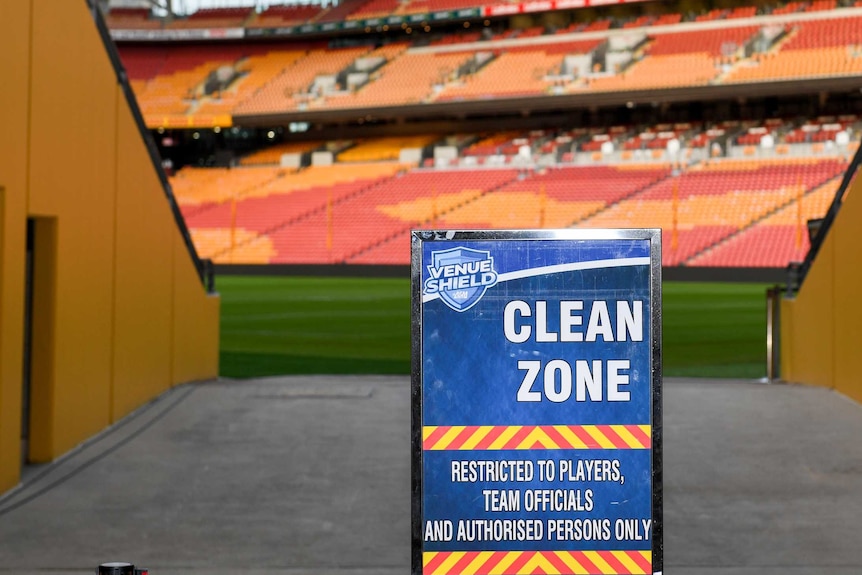 A sign reading "CLEAN ZONE" sits in the tunnel at Suncorp Stadium before an NRL game.