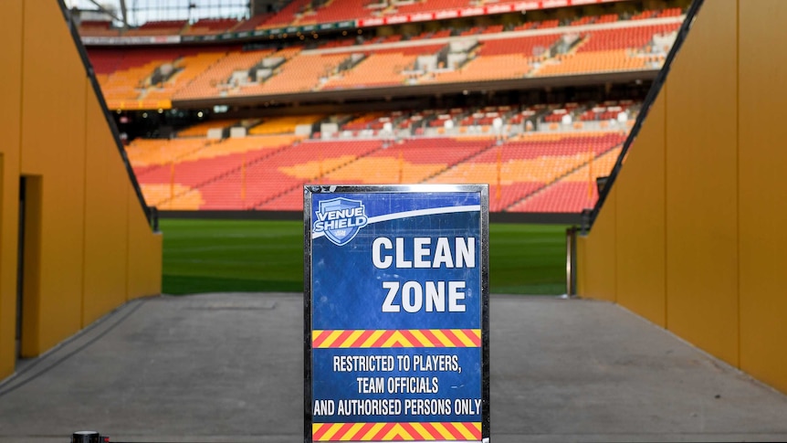 A sign reading "CLEAN ZONE" sits in the tunnel at Suncorp Stadium before an NRL game.
