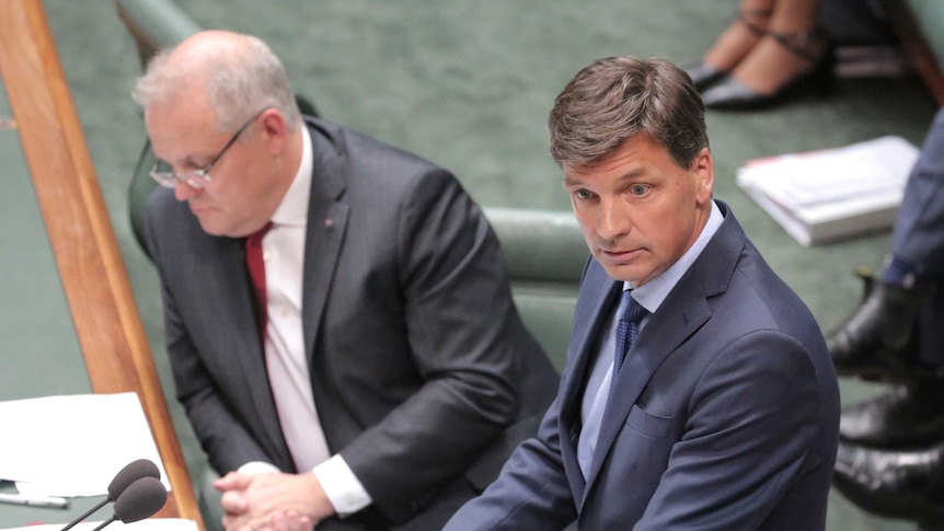 Angus Taylor speaks at the despatch box with Scott Morrison sitting behind him